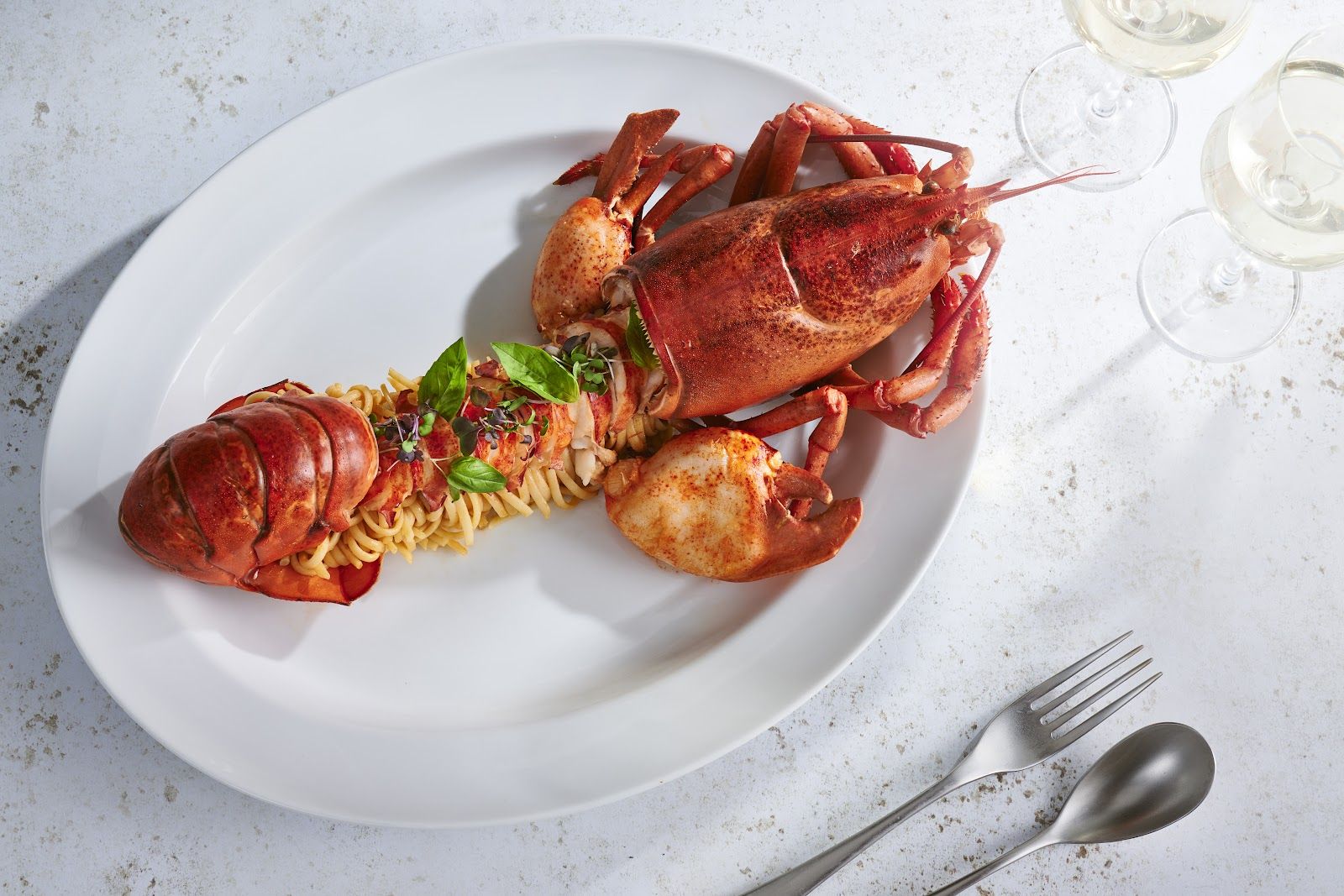 Estiatorio Milos Dubai — signature dish and dining room